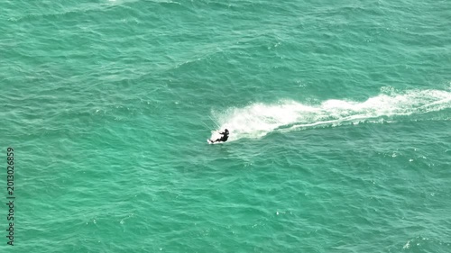 Action Packed Aerial View of Kitesurfer Riding Waves in Turquoise Mediterranean Sea Dynamic Water Sports and Extreme Adventure