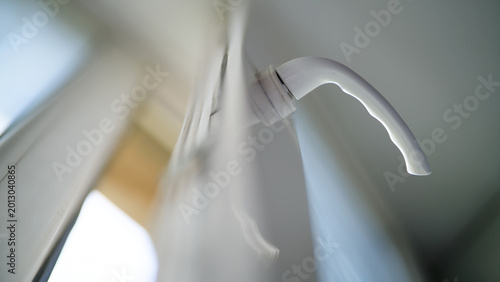 Bild auf Leinwand Close up of a white handle on an open modern plastic window