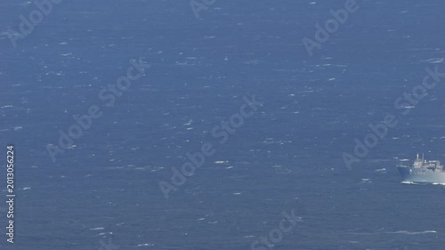 4K telephoto video of Turkish naval vessel TCG Sancaktar (L403) sailing through the Aegean Sea between Kea and Kythnos islands, Greece, filmed on 03 May 2026 in windy maritime conditions with visible 