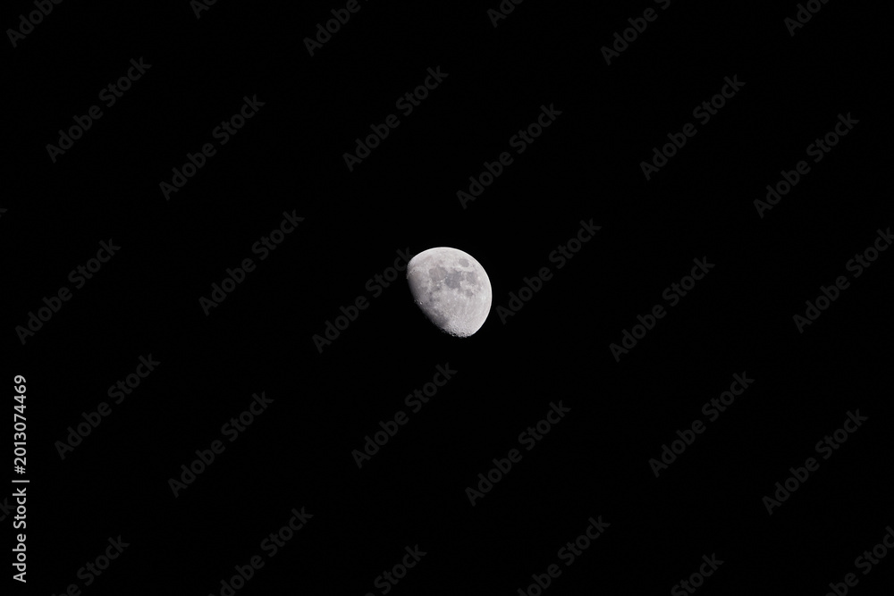 Fototapeta premium Waxing gibbous Moon on a dark evening sky.