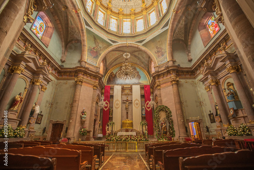 Interior of a Mexican Catholic church, with history and artistic paintings