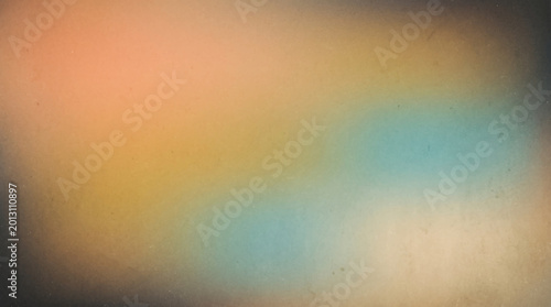 Blurred gradient background with peach, gold, and teal tones