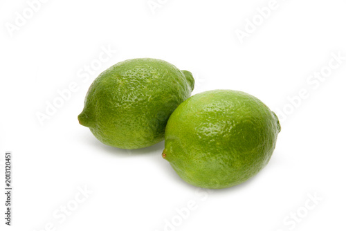 Two citrus lime fruit isolated on white background