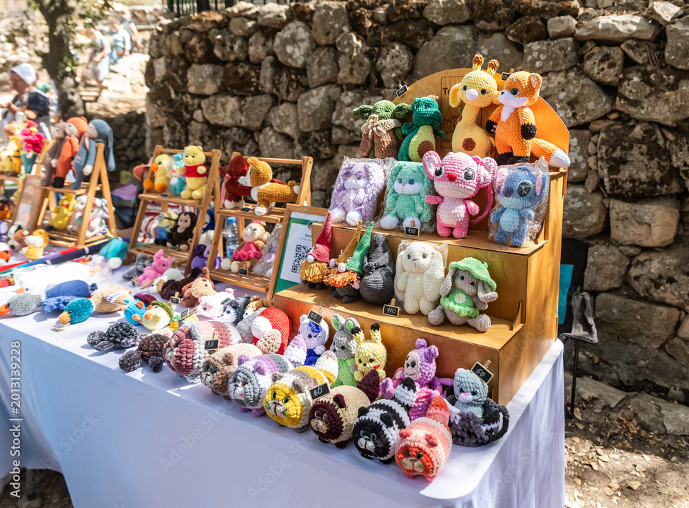 Ταπετσαρία Various knitted handmade toys for sale at annual Jerusalem Knights festival in J