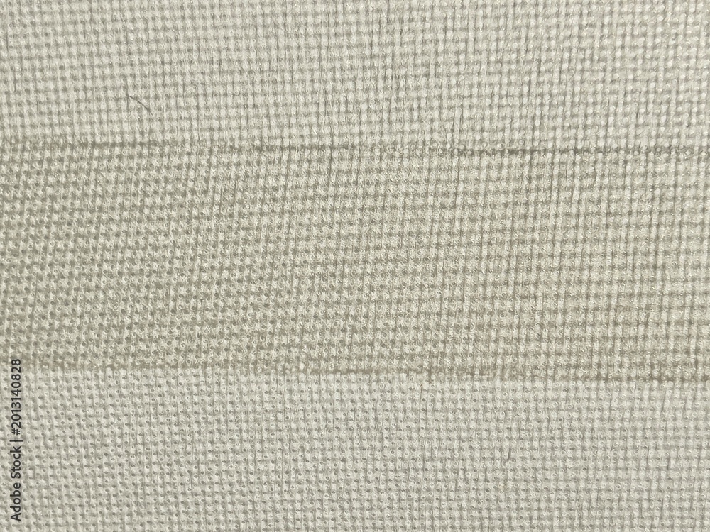 Fototapeta premium Neutral beige textile texture background with fine mesh pattern and horizontal stripes