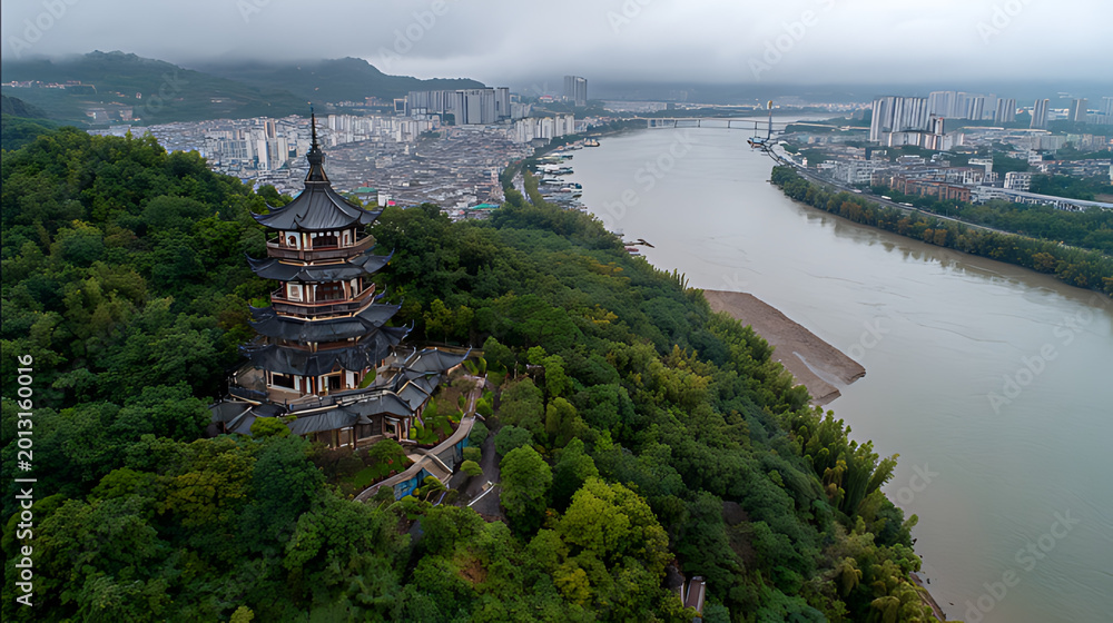 Fototapeta premium A view of traditional architecture featuring ancient villages nestled among lush green trees in the scenic mountains of Northeast Jiangxi in China