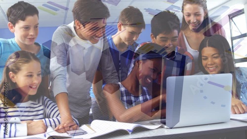 Seated student touching laptop trackpad while school peers leaning in, sharing as hexagons floating