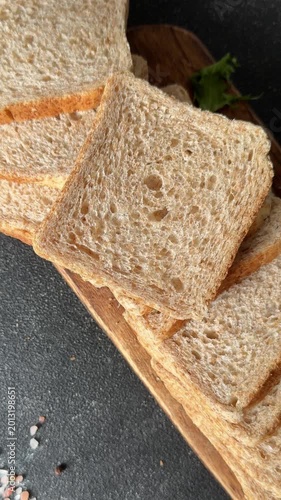 Whole-grain bread fresh baked goods, fluffy bread slices tasty snack fresh, delicious, gourmet food background on the table rustic food, top view copy space