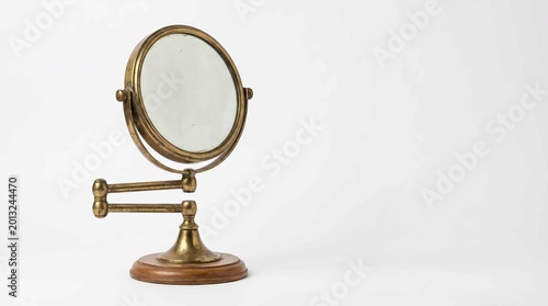 Antique brass magnifying vanity mirror on adjustable arm