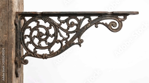 Ornate Cast Iron Bracket Attached to Wooden Post