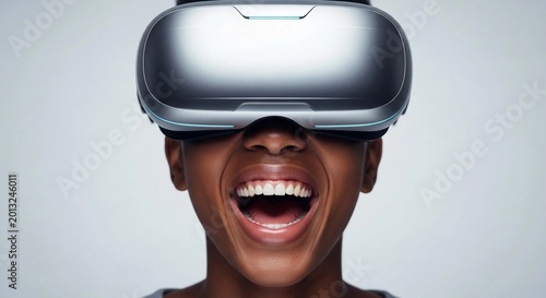Woman laughing while wearing virtual reality headset in studio