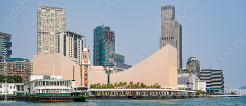 Hong Kong, China : Hong Kong Palace Museum and Star Ferry terminal on the West Kowloon waterfront with Victoria Harbour skyline in the background
