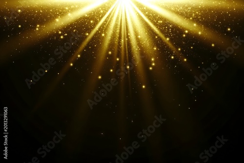 Tableau sur toile Golden light rays and sparkling dust on black background