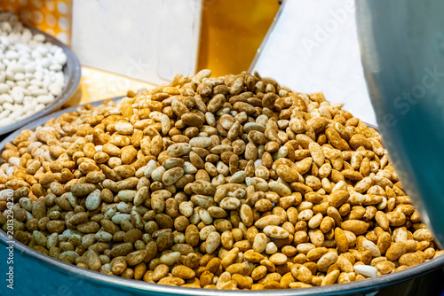 Фотография The peanut, also known as the groundnut, goober, goober pea, pindar or monkey nut, is a legume crop grown mainly for its edible seeds, contained in underground pods