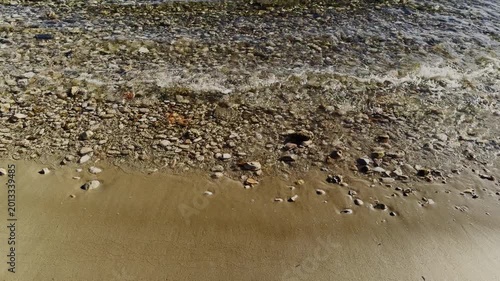 Gentle Sea Waves Crashing on Golden Sandy Beach