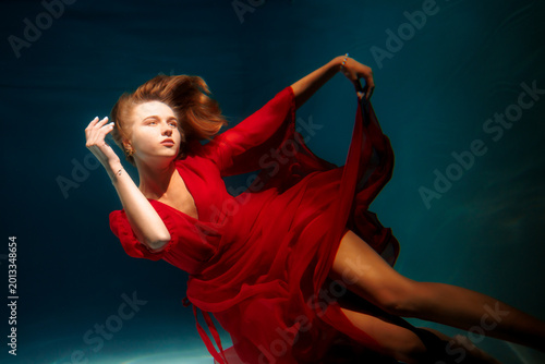 Bild auf Leinwand Mystic sea maiden. Redhaired ocean enchantress with flowing tail