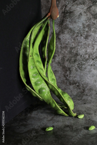 Stink bean or bitter bean on black background. Organic produce commonly used in Asian cooking and street food