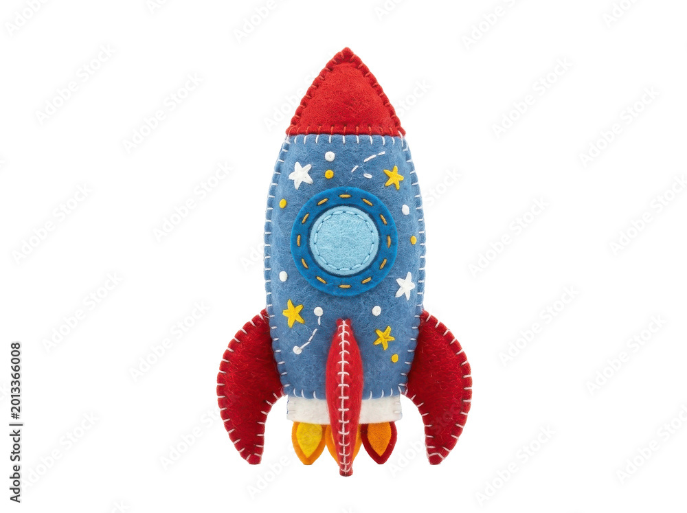 Fototapeta premium A vibrant plush toy rocket soars through a starry night sky with a bold red nose and fins.
