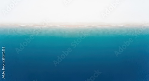 Aerial Top Down View of Turquoise Ocean Waves Meeting a Sandy Beach wi