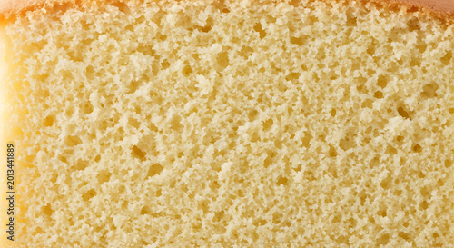 Close-up Macro Texture of Golden Sponge Cake, Soft Crumbs, Baking Ingredient Background