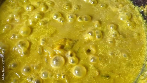 cooking pumpkin sauce in pan