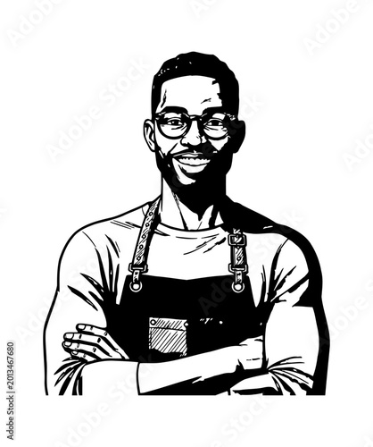 Happy Black Man Wearing Glasses and Apron Standing with Arms Crossed Smiling Confidently at Viewer
