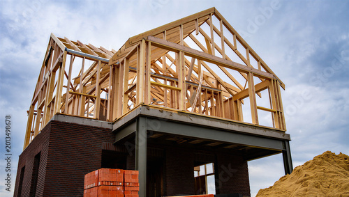 Photos Unfinished House with Wooden Frame Construction and Brick Foundation