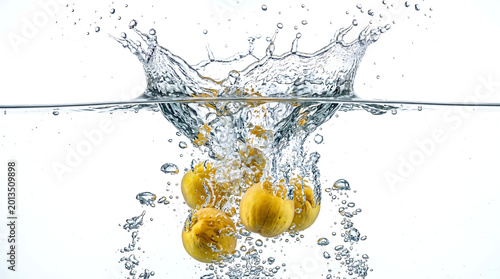 Dynamic Commercial Photography Of Fresh Ripe Yellow Peaches Plunging Into Crystal Clear Water With Massive Splashes