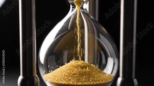 Hourglass with flowing sand symbolizing conceptual art and dynamic energy