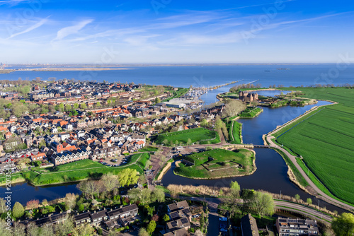 Foto Aerial drone view of medieval Muiderslot Castle (Muiden Castle) with red brick t