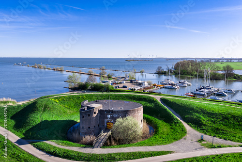 Photography Aerial view of the historic Westbatterij round brick fort in Muiden, Netherlands