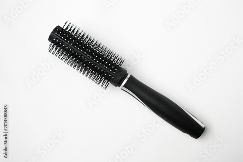 Hair roller comb on white background. Hairstylist equipment