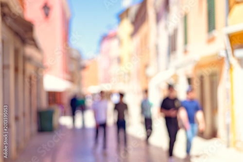 blur abstract people background, unrecognizable silhouettes of people walking on a street