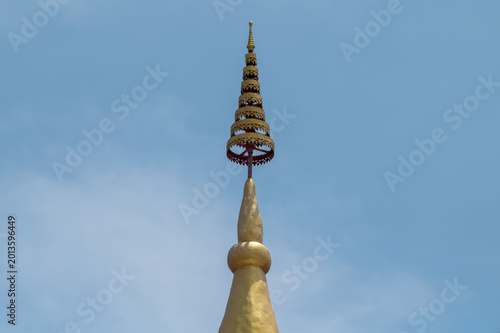 Golden tiered umbrella Chatra on top of a Thai pagoda