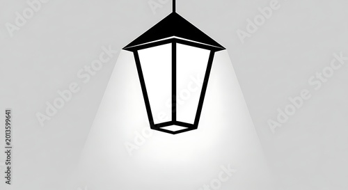 Illuminating a dark space with a hanging light fixture casting a warm glow on a textured wall