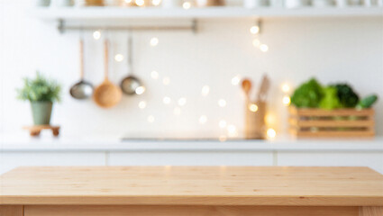 Empty wooden kitchen table in blurred modern white interior background with bokeh fairy lights