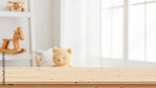 Empty wooden surface in bright nursery background with toys and soft window light for mockup