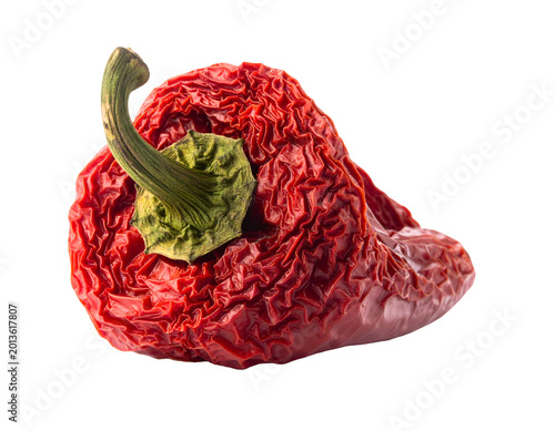 A single, vibrant red pepper, with a wrinkled texture