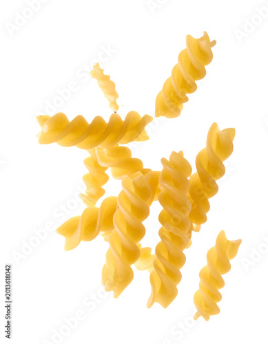 Floating golden fusilli pasta against an isolated backdrop