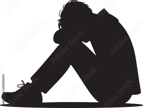 Silhouette of a sad or depressed person sitting on the floor with their head down, expressing feelings of loneliness, grief, or mental health struggles