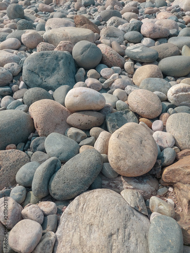 Smooth river stones natural texture background