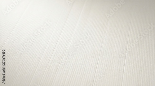 Close-up of a white surface with subtle texture and faint lines running across it giving a sense of depth and detail
