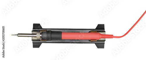 Red electric soldering iron on a stand