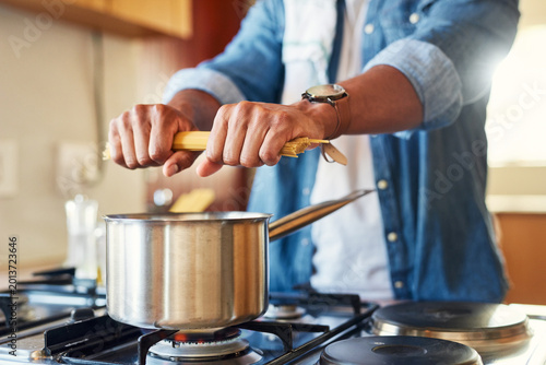 Photography Cooking, food prep or hands at stove with spaghetti, organic meal or boiling pasta in dinner process