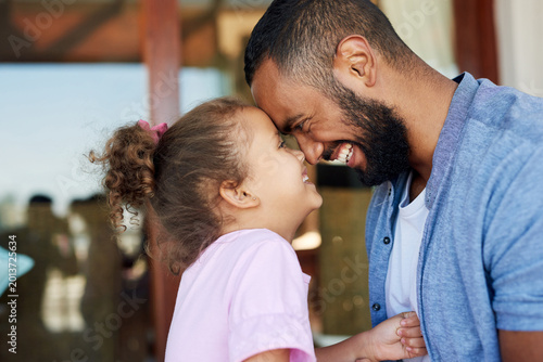 Obraz na płótnie Dad, daughter and forehead touch in home with family together for bonding, love or support