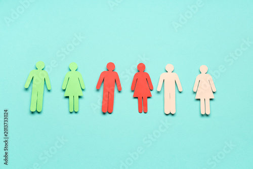 Photos Paper human figures on blue background