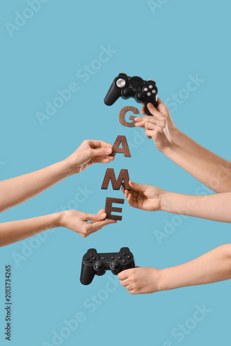 Female hands with word GAME...