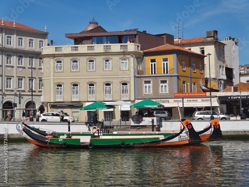 Moliceiro boat cruising canal in Aveiro, Portugal. Aveiro - Portugal