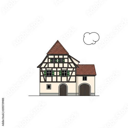 Traditional half timbered house with red roof and green shutters