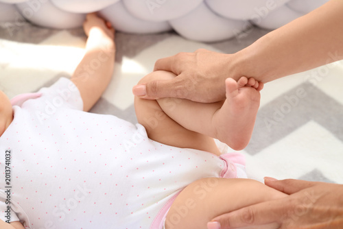 Cute little baby getting ma...